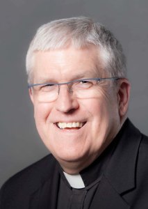 headshot of Fr. John Crossin