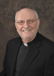 headshot of Fr. John Rausch