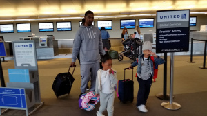 Dominic and his children get their boarding passes for Rome