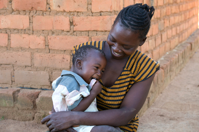 Evelina Banda, 35 years old, with her son, Steven, 16 months old, in Ndombi Village, Zambia. Photo by Jim Stipe/Catholic Relief Services