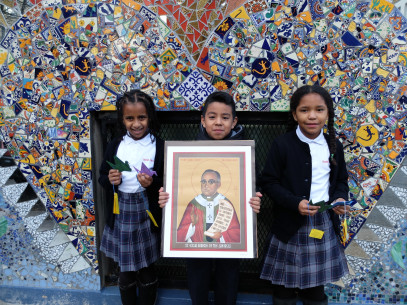 Sacred Heart School--photo of students with St. Romero and cranes - TGF use ONLY